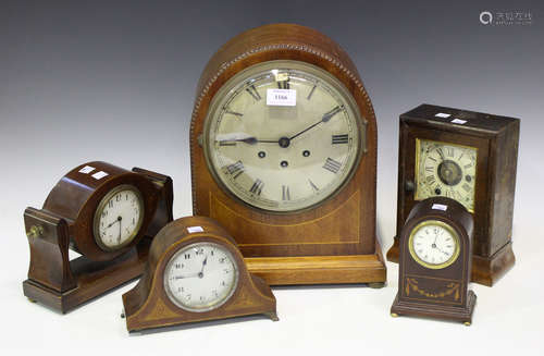 An early 20th century German mahogany mantel clock with eight day movement chiming on gongs, the