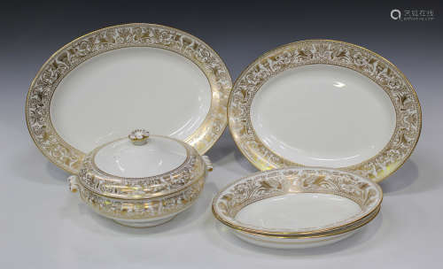 A Wedgwood 'Gold Florentine' pattern part service, comprising two graduated oval platters, two