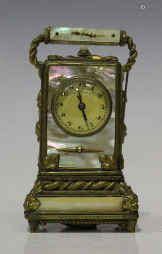 A late 19th century Continental gilt metal and mother-of-pearl mounted miniature carriage timepiece,