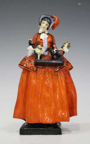 A Royal Doulton figure of 'The Sketch Girl', designed by Leslie Harradine, circa 1923, modelled