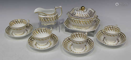 A Spode porcelain part tea service, early 19th century, pattern No. 9869, each decorated in gilt