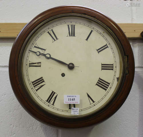 An early 20th century mahogany cased circular wall timepiece with single fusee movement, the painted