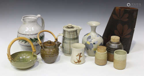 A small group of studio pottery, including a Marianne de Trey white glazed jug with stylized leaf