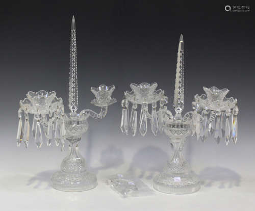 A near pair of cut glass twin branch candelabra, 20th century, each drip pan hung with spear