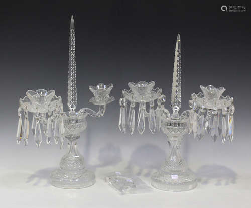 A near pair of cut glass twin branch candelabra, 20th century, each drip pan hung with spear