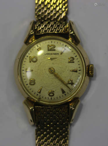 A Longines 9ct gold circular cased lady's wristwatch, the signed silvered dial with gilt Arabic