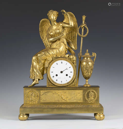 An early 19th century French ormolu mantel clock with eight day movement striking on a bell via an