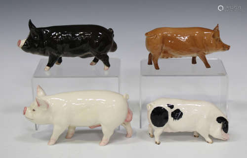 A group of four Beswick models of pigs, comprising Middlewhite Boar, No. 4117, Berkshire Boar, No.