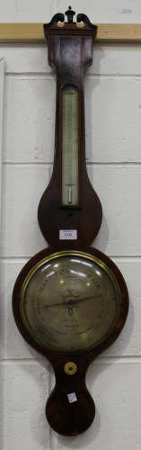 A George III mahogany wheel barometer with mercury thermometer and silvered dials, inscribed 'I.