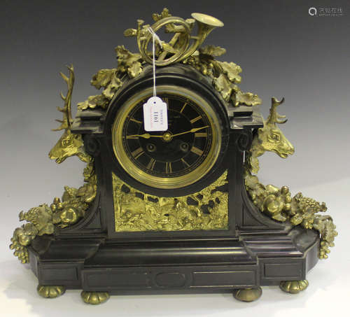 A late 19th century French brass mounted slate mantel clock with eight day movement striking on a