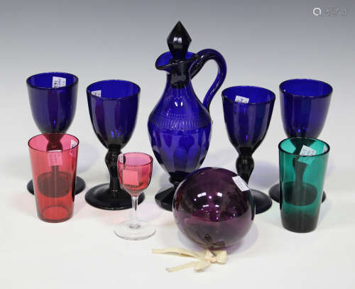 A small group of coloured glassware, 19th century and later, comprising a blue decanter and stopper,