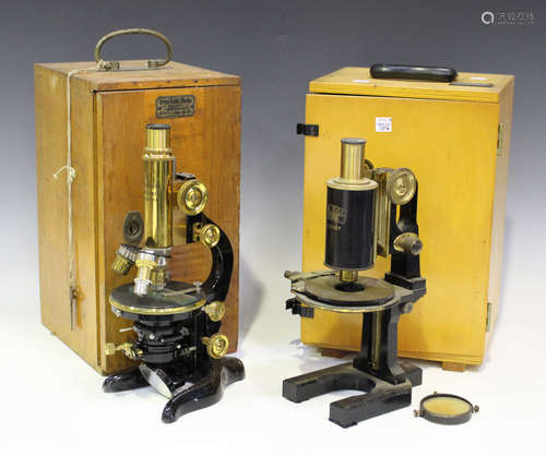 An E. Leitz lacquered brass and black enamelled monocular microscope, signed 'Ernst Leitz Wetzlar