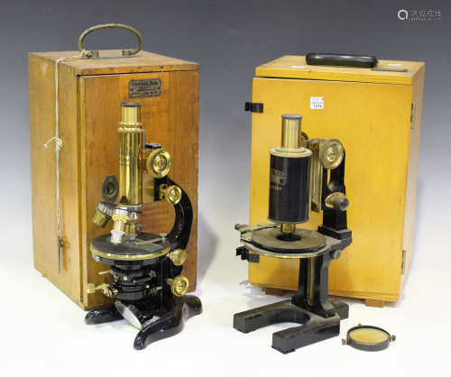 An E. Leitz lacquered brass and black enamelled monocular microscope, signed 'Ernst Leitz Wetzlar