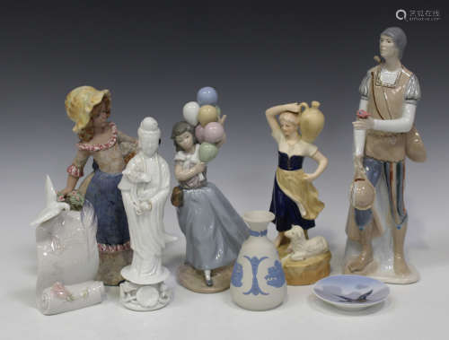 A group of decorative ceramics, 20th century, including a Lladro porcelain figure Balloon Seller,