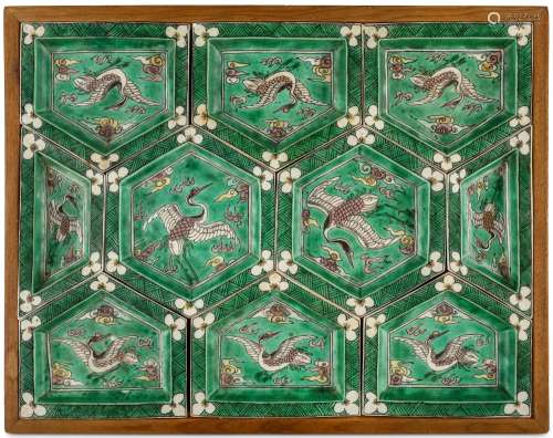A CHINESE FAMILLE VERTE SWEET MEAT SET. Kangxi. The set of ten dishes of interlocking shapes, together forming a rectangle, each decorated with a crane in flight among clouds and flames, 25 x 32cm. (11) 清康熙   五彩仙鶴紋攢盤