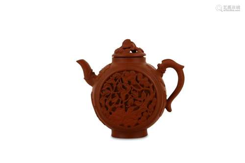 A CHINESE YIXING ZISHA FLATTENED SPHERICAL TEAPOT AND COVER.   Kangxi. The double-walled teapot decorated with pierced circular roundels on either side depicting fruiting finger-citron plants and pines emerging from rockwork, the cover surmounted