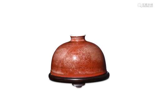 A CHINESE PEACHBLOOM-GLAZED 'BEEHIVE' WATERPOT, TAIBAIZUN. Kangxi mark and of the period. Of classic taibaizun-form, the body incised with three stylised archaistic dragon roundels, the exterior applied overall save for the rim and base with a