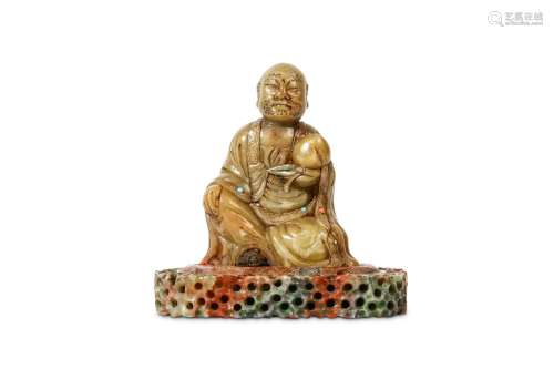 A CHINESE SOAPSTONE CARVING OF A LOHAN HOLDING A PEACH. Early Qing, signed Zifu. Carved seated on woven padded cushion on a pierced rocky base, with a contemplative face incised with bristly eyebrows and moustache, a large peach held in the left