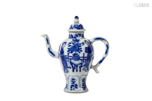 A CHINESE BLUE AND WHITE ‘LADIES’ TEAPOT AND COVER. Kangxi. Of baluster form, decorated with ladies separated by a plant on a table in a garden, above a lappet band of lappets to the foot enclosing flowers, 14cm H. (2) Provenance: English private