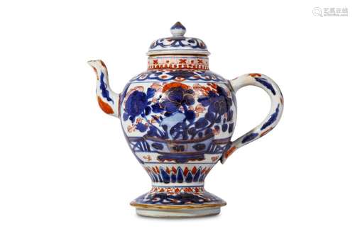 A CHINESE IMARI-DECORATED TEAPOT AND COVER. Kangxi. Of baluster form with a spreading stepped foot, and surmounted by a domed cover with bud finial, the body with a jardinière filled with peonies, with decorative bands around the base and neck, 23cm