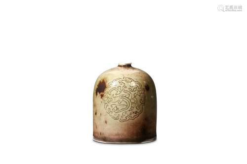A CHINESE PEACHBLOOM GLAZED WATERPOT. Qing. The cylindrical sides rising to rounded shoulders contracting to a narrow waisted neck below a short narrow lipped mouthrim, incised around the body with two medallions formed of the curled bodies of
