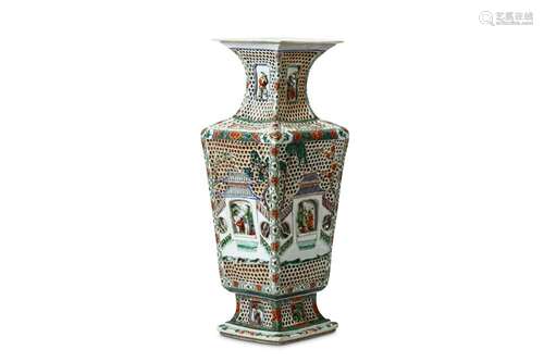 A LARGE CHINESE FAMILLE VERTE RETICULATED VASE. Kangxi. Of  rectangular baluster form with a spreading foot and neck, the body with double walled panels with pierced bee-hive trellis, around a painted walled garden scene with details of figures and