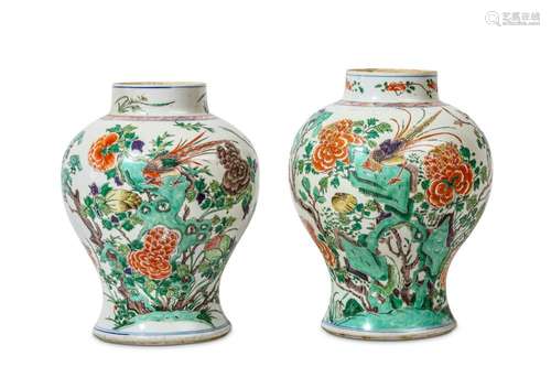 A NEAR PAIR OF CHINESE FAMILLE VERTE ‘PHEASANT ON ROCKS’ VASES. Kangxi. Of baluster form, each painted with a pheasant on ornamental rockwork among flowering peony branches, birds and butterfly, a floral band around the neck, 36cm H. (2)