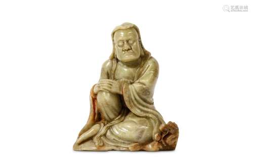 A CHINESE CARVED SOAPSTONE SEATED LOHAN. 17th century. The hands resting on the right knee raised from below long flowing robes, the face with bulging eyes and a stern expression, the figure seated beside a small dragon on his left side a pearl