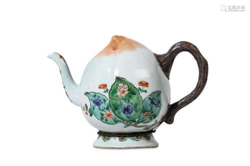 A CHINESE FAMILLE VERTE CADOGAN TEAPOT. Kangxi. The body naturalistically modelled as a peach on a spreading foot, each side painted in enamels with three overlapping leaves covered in prunus flowers, replacement handle, 14cm H. 清康熙