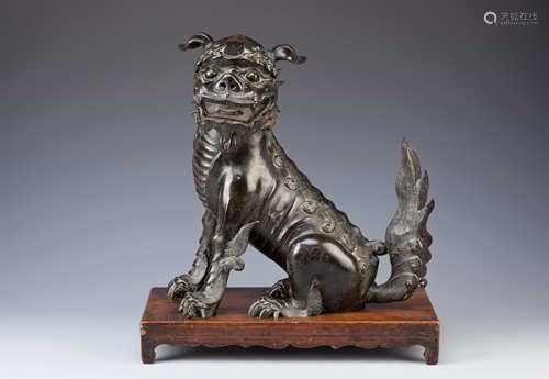 A CHINESE BRONZE LION DOG INCENSE BURNER