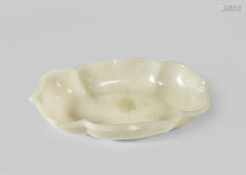 A CHINESE PALE CELADON JADE LOBED BOWL