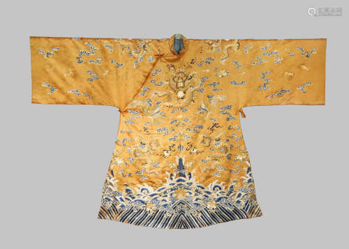 A CHINESE APRICOT-GROUND SILK 'EIGHT DRAGON' ROBE