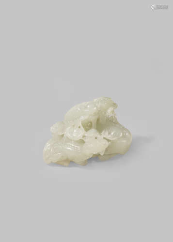 A CHINESE PALE CELADON JADE CARVING OF MYTHICAL BEASTS