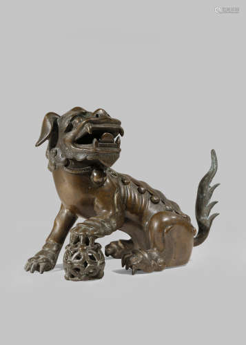 A CHINESE BRONZE LION DOG