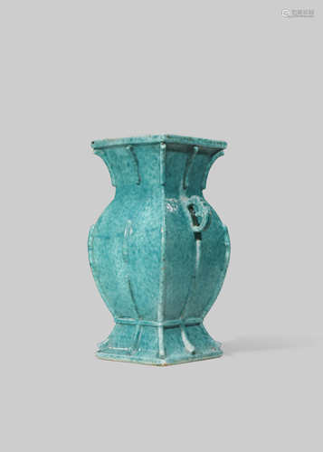 A CHINESE MOTTLED-GREEN ARCHAISTIC VASE