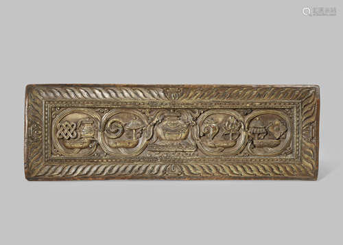 A TIBETAN CARVED WOOD MANUSCRIPT COVER