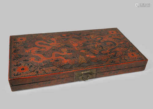 A CHINESE RED AND BLACK LACQUER 'DRAGON' BOX