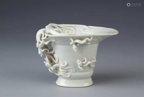 A CHINESE WHITE GLAZED LIBATION CUP