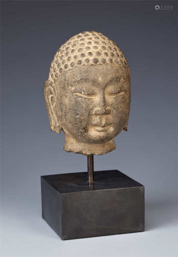 A CHINESE STONE HEAD OF BUDDHA