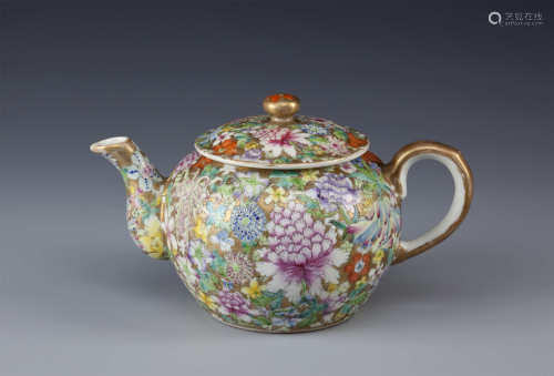 A CHINESE FAMILLE ROSE MILLEFLEURS TEAPOT AND COVER