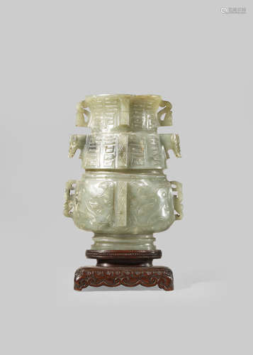 A CHINESE ARCHAISTIC GREY-GREEN JADE VASE