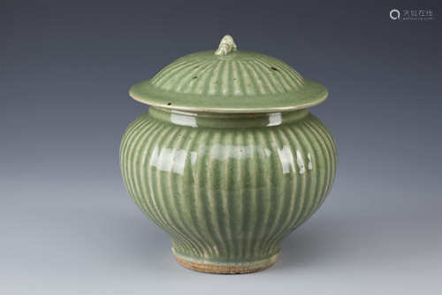 A CHINESE CELADON GUAN AND COVER