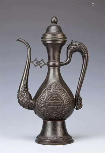 A CHINESE BRONZED-COPPER TIBETAN-STYLE EWER AND COVER