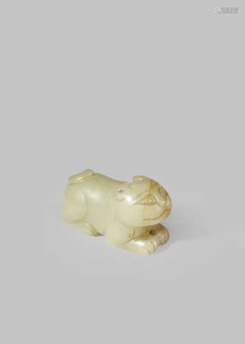 A CHINESE PALE CELADON JADE CARVING OF A TIGER
