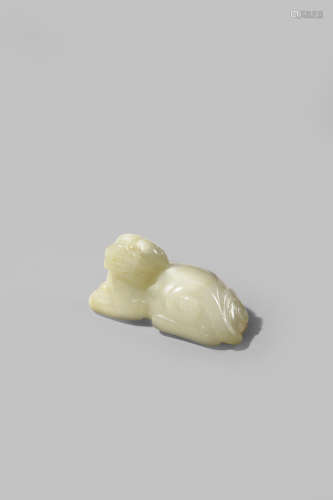 A SMALL CHINESE PALE CELADON JADE CARVING OF A QILIN