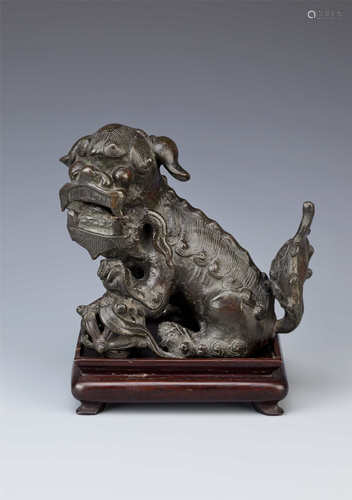 A CHINESE BRONZE LION DOG