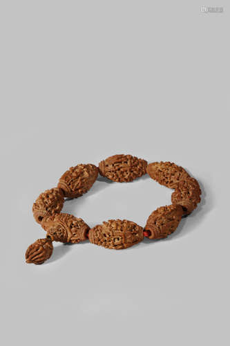 A CHINESE OLIVE STONE BRACELET