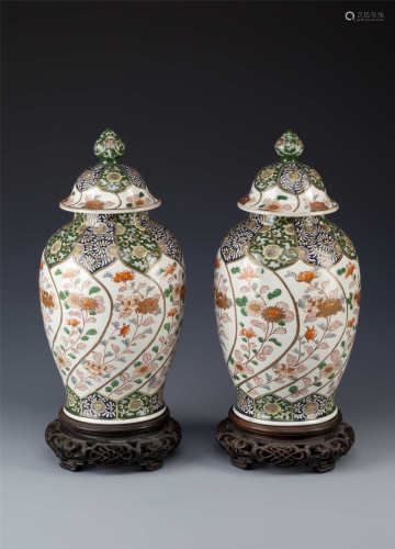 A PAIR OF JAPANESE BALUSTER VASES AND COVERS