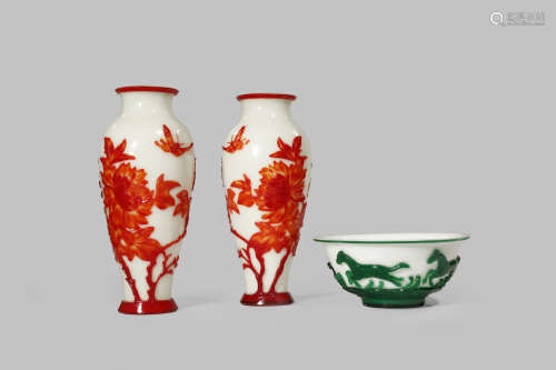 A PAIR OF BEIJING GLASS RED OVERLAY VASES
