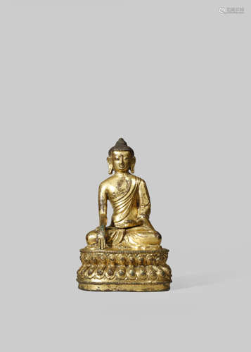 A TIBETAN GILT-COPPER FIGURE OF BUDDHA SHAKYAMUNI